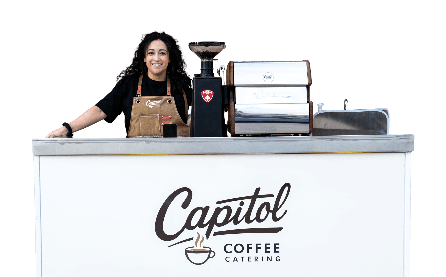 Smiling Capitol Coffee barista behind the Capitol Coffee Catering espresso cart